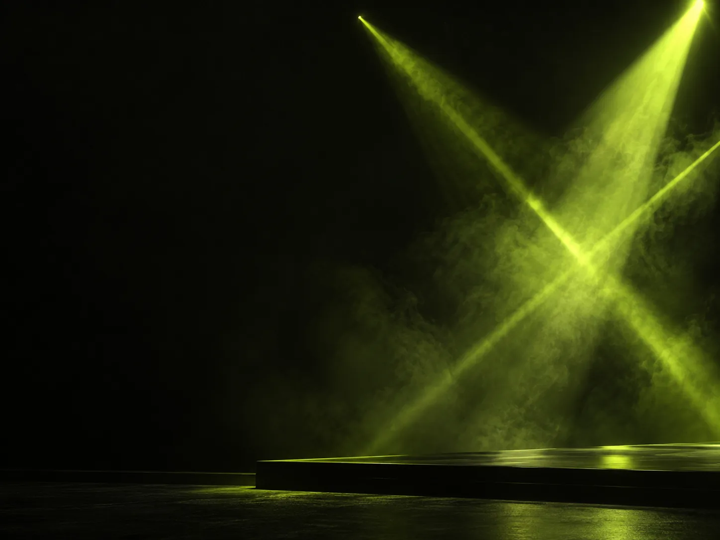 Lime light beams crossing through haze above a stage