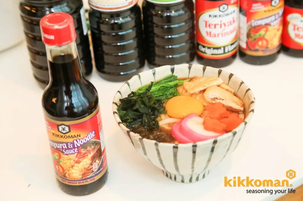 Kikkoman soy sauce with a finished ramen bowl