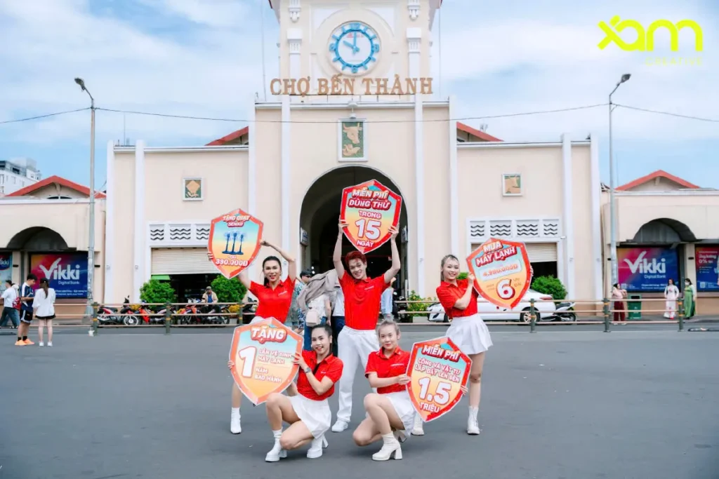 Walking billboard team at Ben Thanh Market gate