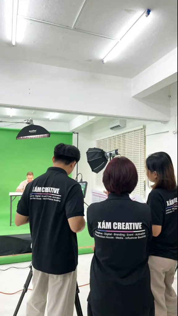 XAM crew setting up the green screen studio