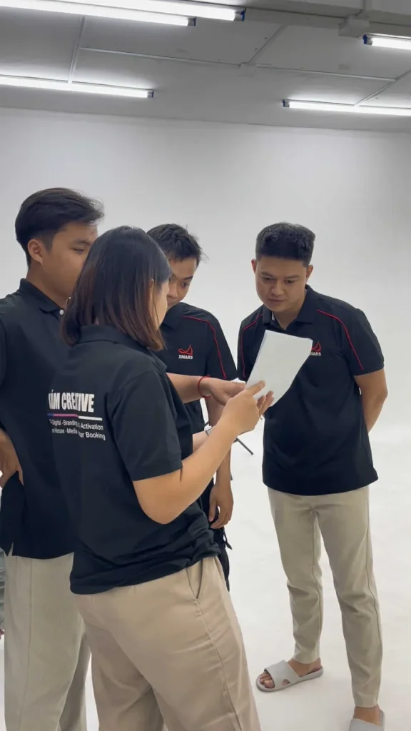 XAM crew briefing talent on set